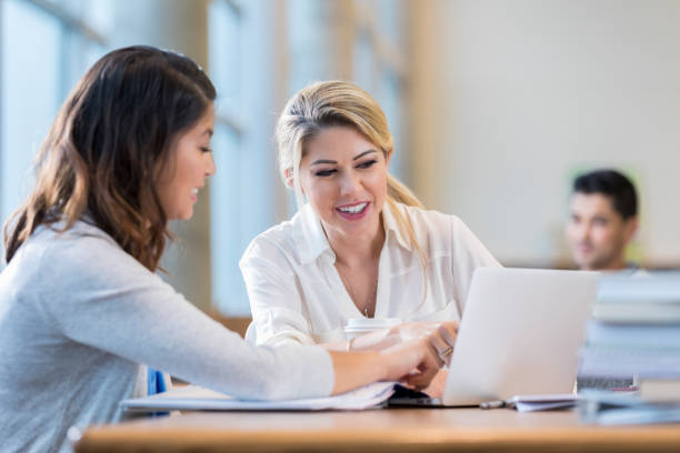 Women reviewing something on a laptop computer